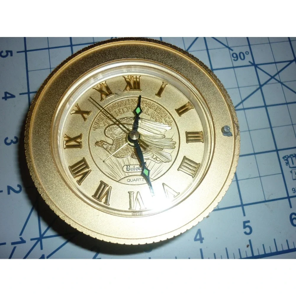Bulova B0675 Gold Tone Coin Face Eagle Quartz Alarm‎ Desk Clock Roman Numerals
